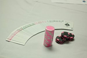 pink-poker-chips-and-cards-300x200